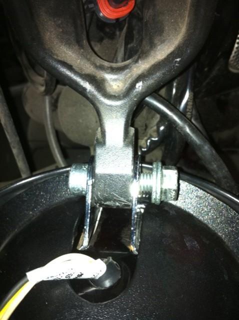 Using the 15mm socket with extension and an 8mm Allen wrench remove the headlight mounting bolt.