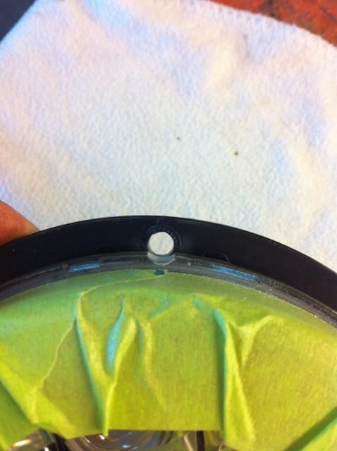 5. Using a Dremel tool or round file make 5 grooves approximately 1/16 into the edge of the LED headlight.