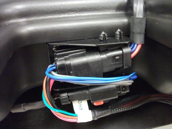 Next connect the subwoofer harness ten pin connector to the subwoofer, engage the red locking tab and then