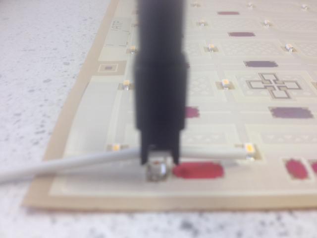 Place the 18AWG wire over the IDC connector (as shown below) 2.
