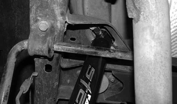 Install the supplied Fabtech shock using the factory upper hardware to mount the bar bin and the supplied ½ x 2 ½ bolt, large USS washers, and hardware.