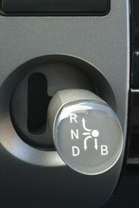 B = engine braking. Be sure to move the motion selector back to D after using B, or you will decrease the mpg for normal driving.