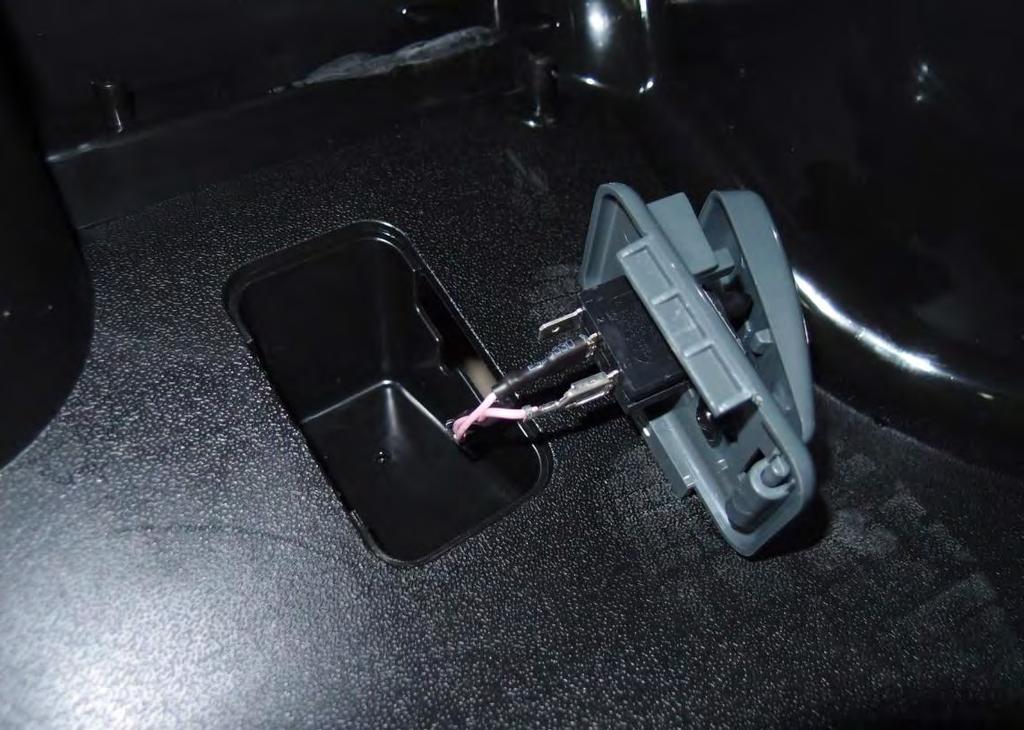 Use a screwdriver to pry the cover off of the vehicle.