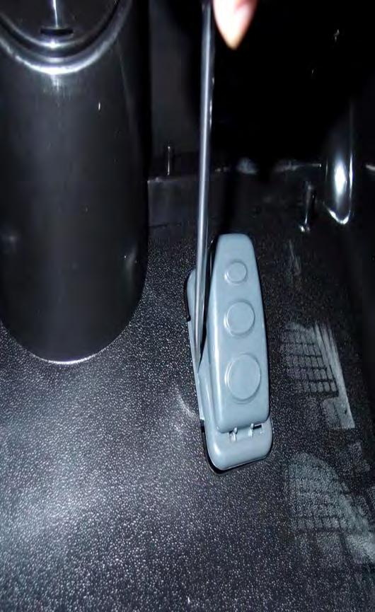 Step 3: After checking the foot pedal, snap it back into place by first sliding in the