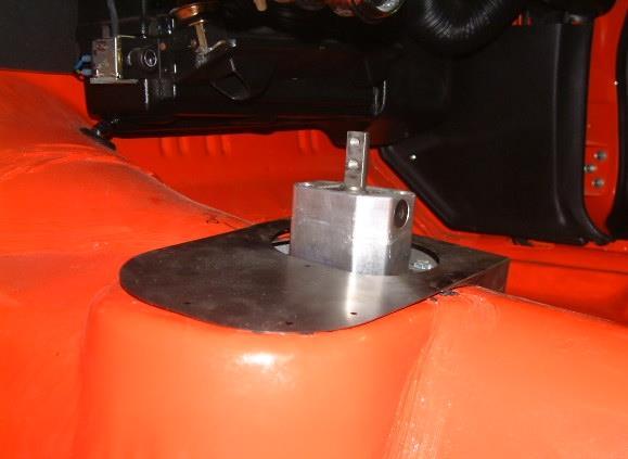Align the holes in the left side of the new seal plate with the original shift boot screw holes and fasten using the original screws. See photos below. ii.