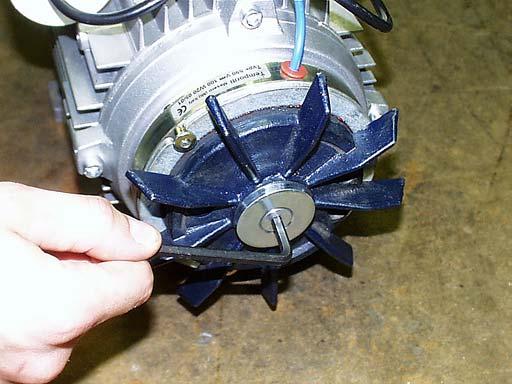 How to Adjust the Braking Gap 2. Remove the Fan Cover, as shown in Exhibit D, if necessary to view or measure the Braking Gap, or to troubleshoot a Brake problem. Removing the fan cover.