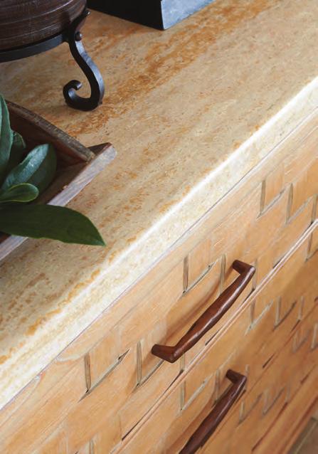 A honed travertine top on the Perth Bachelor s Chest offers a rich