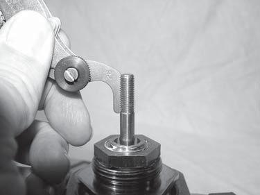 Record this reading to three decimal places. STEP 2) Measure the LENGTH of the threaded area of the valve stem, and record this information for Dimension B on the retrofit Form.
