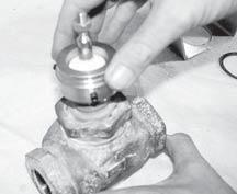 STEP 1) Remove system pressure from the valve. Remove the external packing nut.