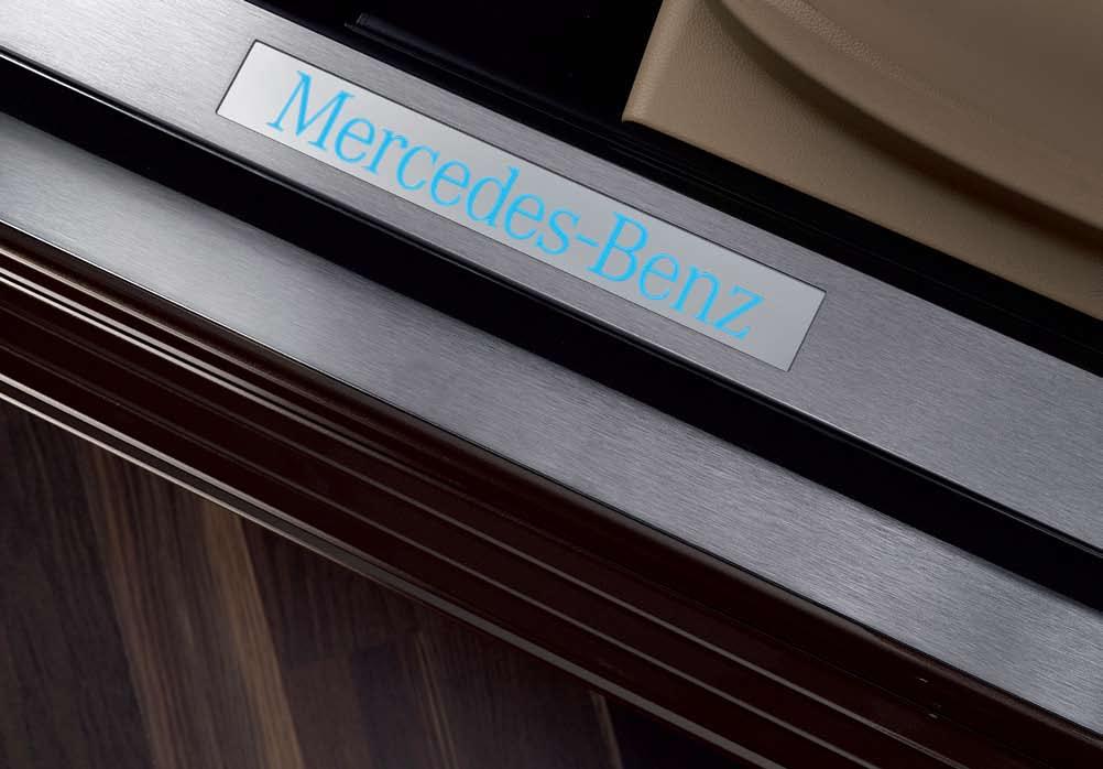 Door sill panels Wood/leather steering wheel Illuminated door sill panels The blue illuminated Mercedes-Benz lettering is activated every time you