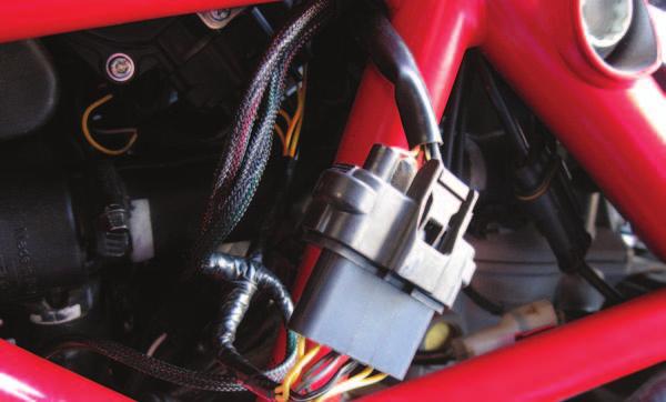 11 Plug the pair of connectors with the YELLOW colored wires in-line of the rear fuel injector and the stock wiring harness. FIG.