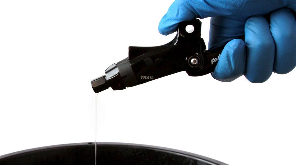 Squeeze the lever to pump excess brake fluid from inside the lever assembly.