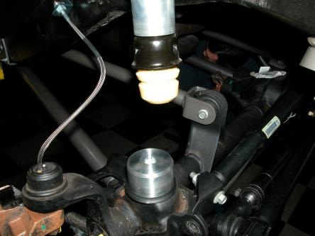 Installing Rear Components. 1. Install rear sway bar links using factory hardware. Fig.29 Fig.29 2. Drill a 5/16 hole into the coil spring base cup.