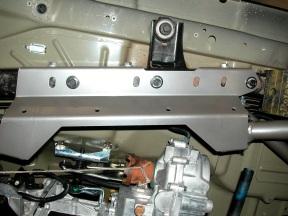 Side Skid brackets are left and right. Starting on the left side of the vehicle, line up the factory holes in the bottom of the frame with the holes in the side skid bracket.