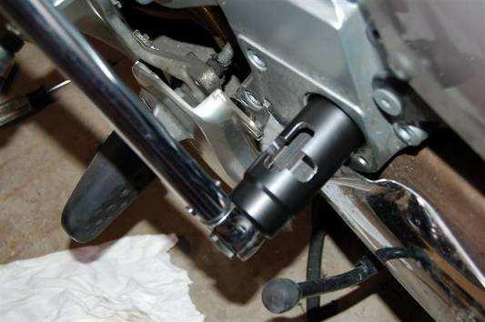 11. Install the left lock nut with a modified 30mm socket and torque to 160Nm while
