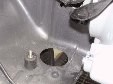 Figure 19 Insert the vibra-mount into the hole next to
