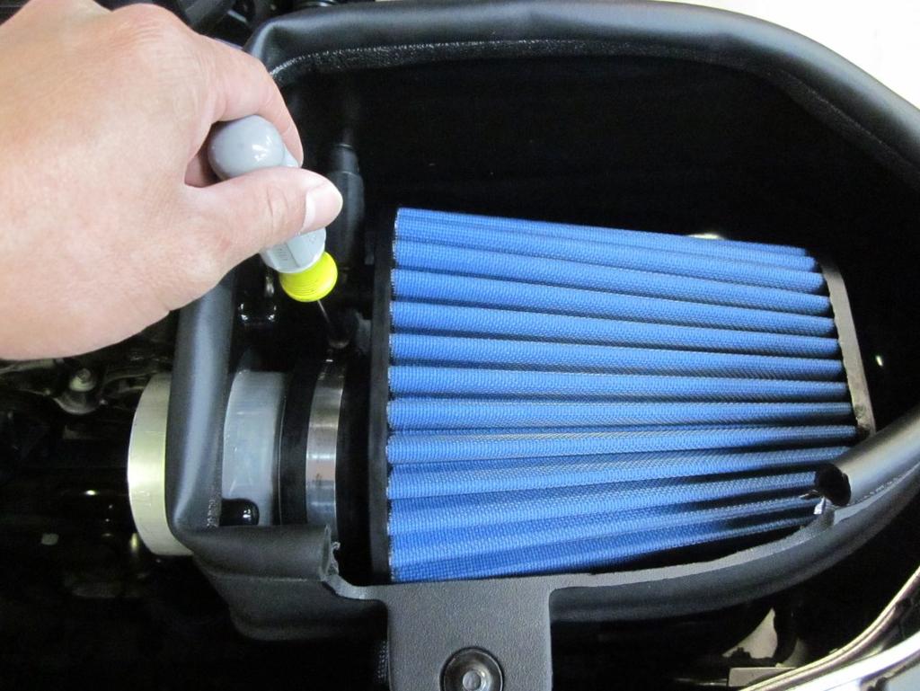 l) Insert the hose-fitting assembly into the air filter and