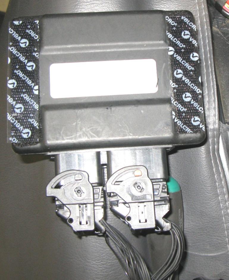 29. Attach Velcro strips using the double stick tape to the back of the DPT ECU.