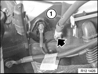 Coil up the excess wire and zip tie it out of the way behind the power steering reservoir. See figure 13.