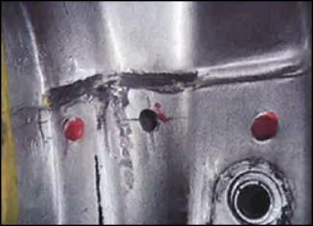 Additional 5mm hole should be centered between the original 4mm and 8mm spot welds. Location of additional weld should be 6mm from the top edge of the sheet metal. 9.