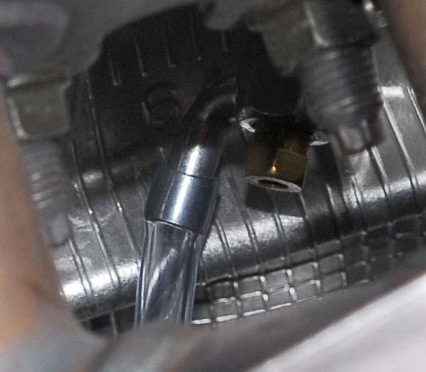 Use the 10mm socket and open the drain. Allow as much coolant to drain as will drain out.