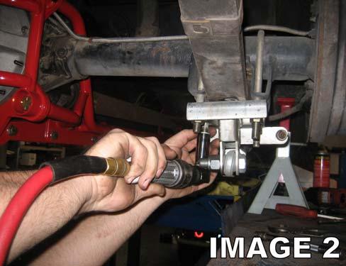 9. Using a 3/4 socket, remove the leaf spring U-bolts on the rear end.