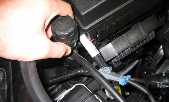 23 Using a pair of pliers, loosen the upper coolant hose clamps and remove the upper coolant hose.