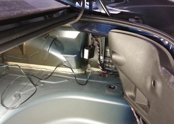 15 If not already done, disconnect the negative battery cable in the trunk. FlowCharger Mounted 16 Securely mount the FlowCharger to the bottom of the rear deck in the trunk.