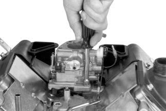 Leave lever attached to the throttle linkage and lay assembly on the top of the crankcase. Figure 9-19.