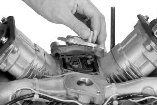 Figure 9-39. Removing Breather Reed. Remove Valve Covers Three valve cover designs have been used.