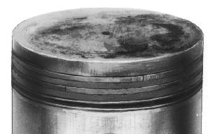 When cylinder temperatures get too high, lacquer and varnish collect on pistons causing rings to stick, which results in rapid wear. A worn ring usually takes on a shiny or bright appearance.