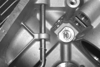 3. 6 mm Governor Shaft: Install the plain washer and then insert the hitch pin into the smaller, lower hole of the