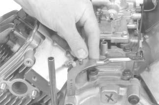 ground lead to the carburetor mounting screw. See Figure 11-76. Figure 11-76. Ground Lead on Carburetor Mounting Screw.