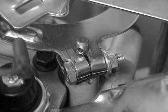 Check how the end of the throttle linkage aligns with the bushing hole in the governor lever. See Figure 5B-40. It should fall in the center of the hole.