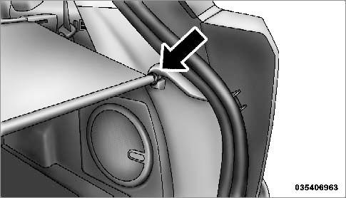 156 UNDERSTANDING THE FEATURES OF YOUR VEHICLE Using the handle, pull the cover toward you and guide the rear cover posts into the guides located on both sides of the rear trim panel. WARNING!