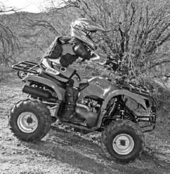 To ride down a hill with the ATV, follow the instructions below. 1. Check the terrain carefully for any obstacles before you go down the hill. 2. Point the ATV straight down the hill. 3.