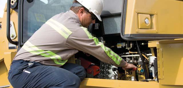 The following features help you to easily service your loader: Fuse panel with ET port: Located to the inside of the cab, on the rear right side console, the fuse panel also includes the ET port.