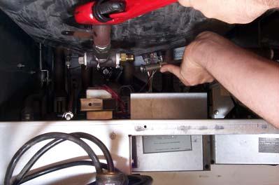 Remove oil-return line and set aside (see Step 15 