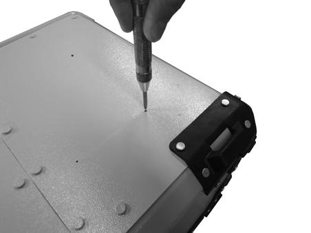 STEP 12: Remove the buffer/template from the pannier and use a center punch tool to create a pilot dent in the surface of the aluminum.