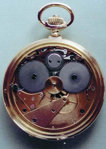 9. An underdial view of the twin-barrel watch. The mobiles of the Daniels-type power reserve indication are beneath the cock near the left-hand winding wheel.