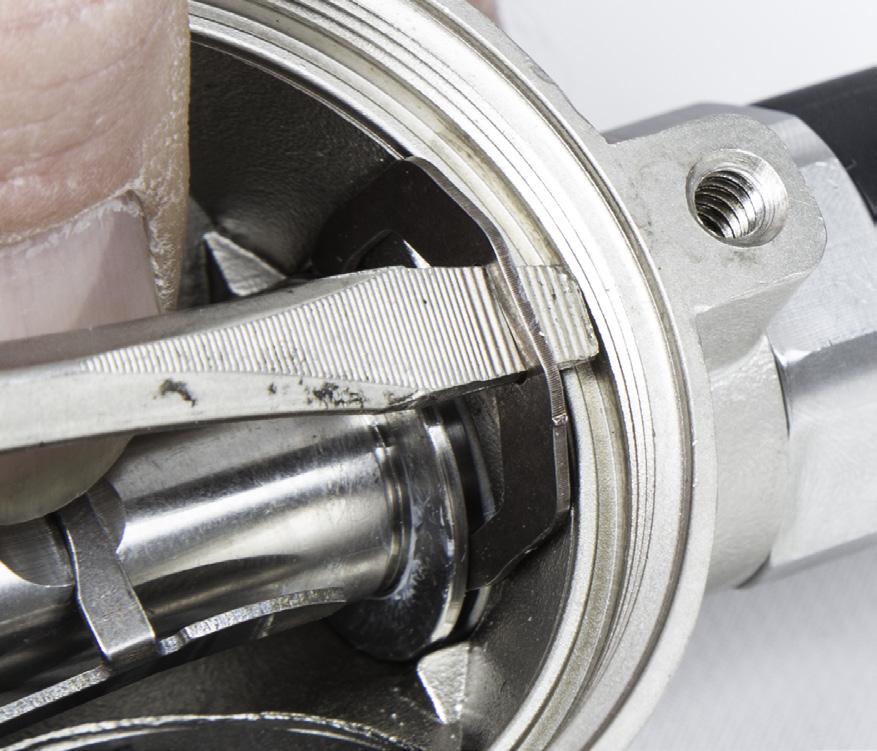 Carefully insert the tip of a flat blade screwdriver into the slot at the top of the Lock Clip to free it from its locking position and slide the clip away from the regulator Main Tube. 6.