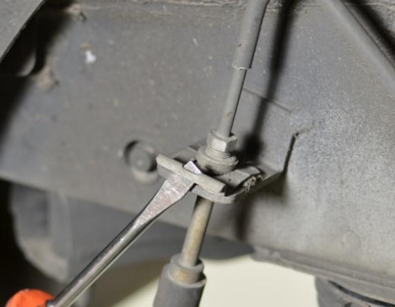 bar. c) Remove the brake line retaining clip using as