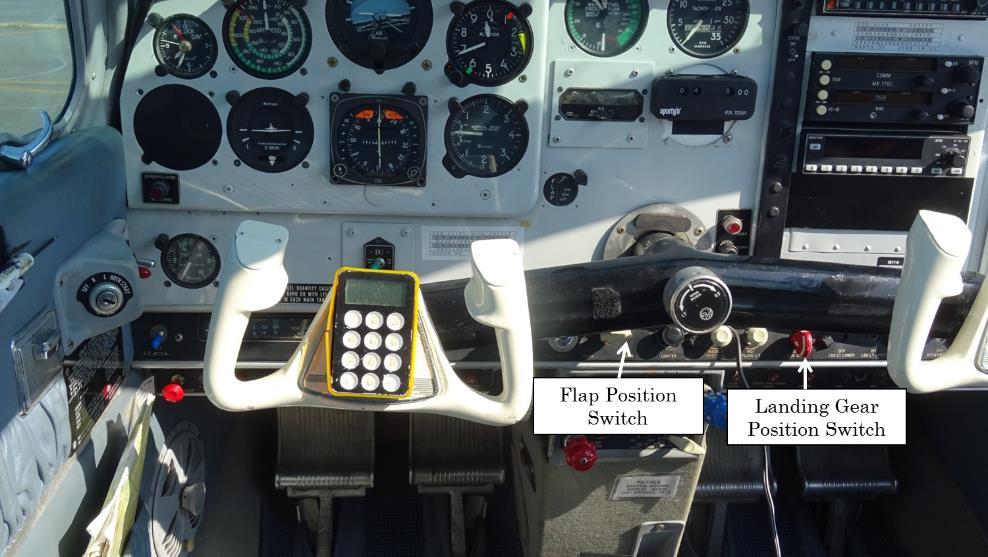 Photo 3 Location of Flap position switch and Landing gear position switch 2 Landing Gear Warning Device When the right main landing gear strut is shortened more than the specified value, the safety