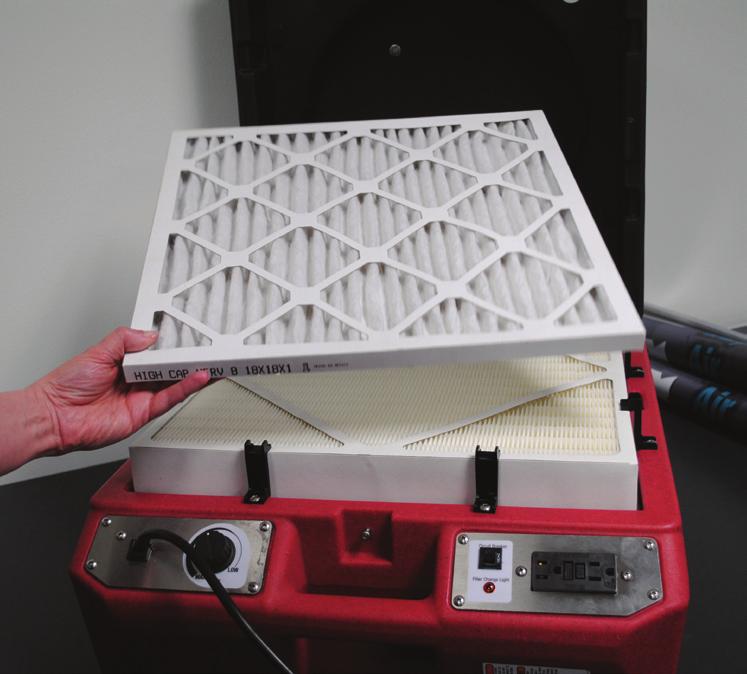 If the airflow is still too low, the HEPA filter must be changed. To remove the HEPA filter, follow these steps: 1. Loosen the eight screws one revolution 2. Rotate all eight clips out of the way. 3.