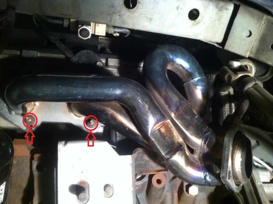 Remove the nut from the EGR fitting and move the EGR tube out of the way. 18. Remove exhaust manifolds using a 13mm deep socket and extensions.