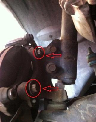 Remove caliper mount bolts using 15mm socket and breaker bar, then use standard socket wrench