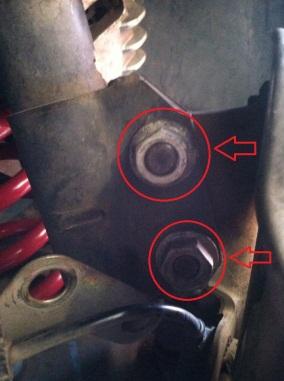 Then, using a 24mm socket and breaker bar on the nut and a 21mm socket on the bolt loosen the 2 bolts.