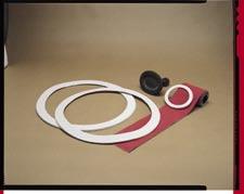 Gaskets WIRE INSERTED TETRAGLAS-T HANDHOLE GASKETS Manufactured from texturized fiberglass yarns with a brass wire then coated with a white rubber compound.