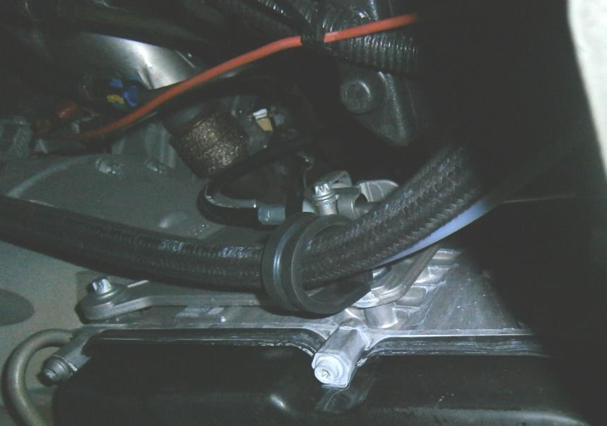 5 Re-install the OEM bolt with supplied P-clamp, route all three hoses