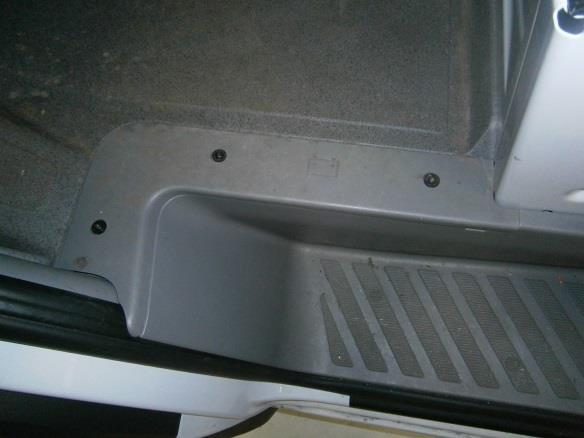 Remove the driver side step cover, and